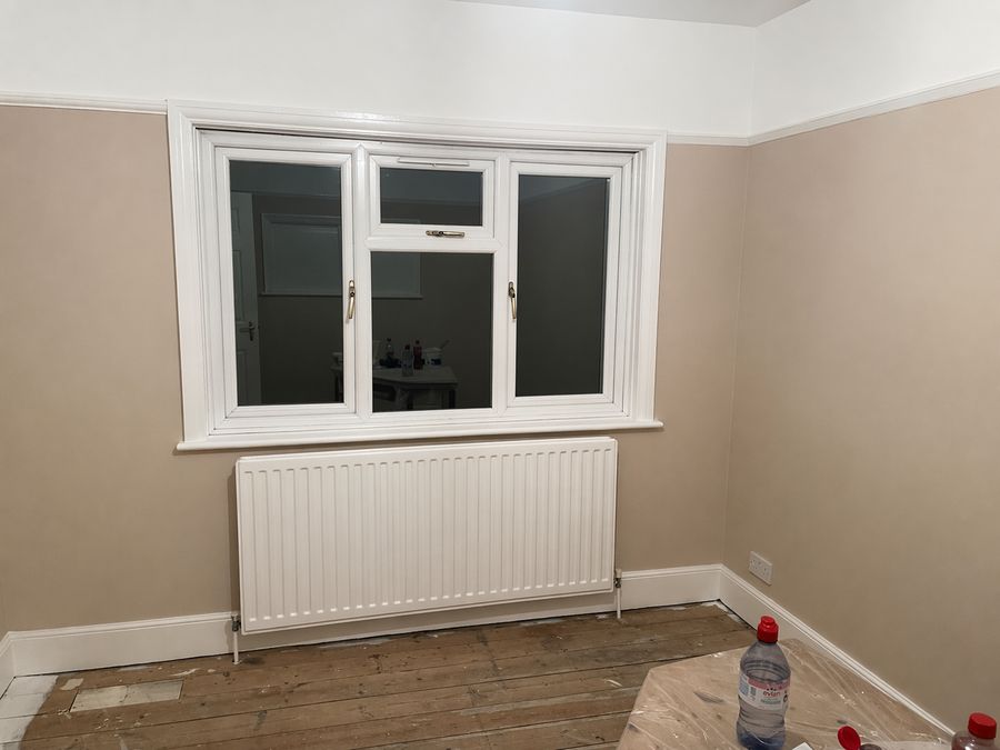 Small room redecorated with new skirting and a clean paint finish