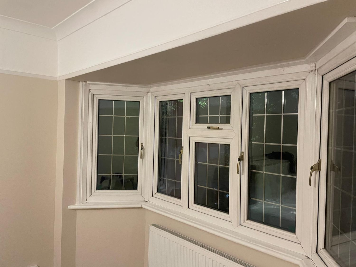 Finished bay window with decorated woodwork and walls